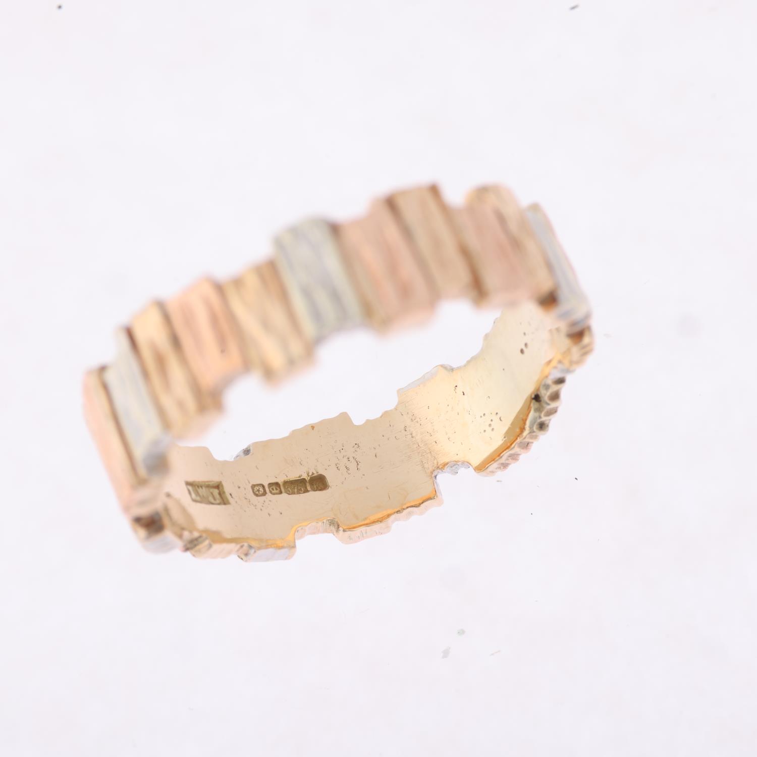 A 1980s 9ct three-colour gold abstract band ring, maker LWJ, Sheffield 1984, textured bark offset - Image 2 of 4