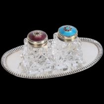 HROAR PRYDZ - a pair of Norwegian sterling silver-gilt blue and purple enamel glass cruets, on