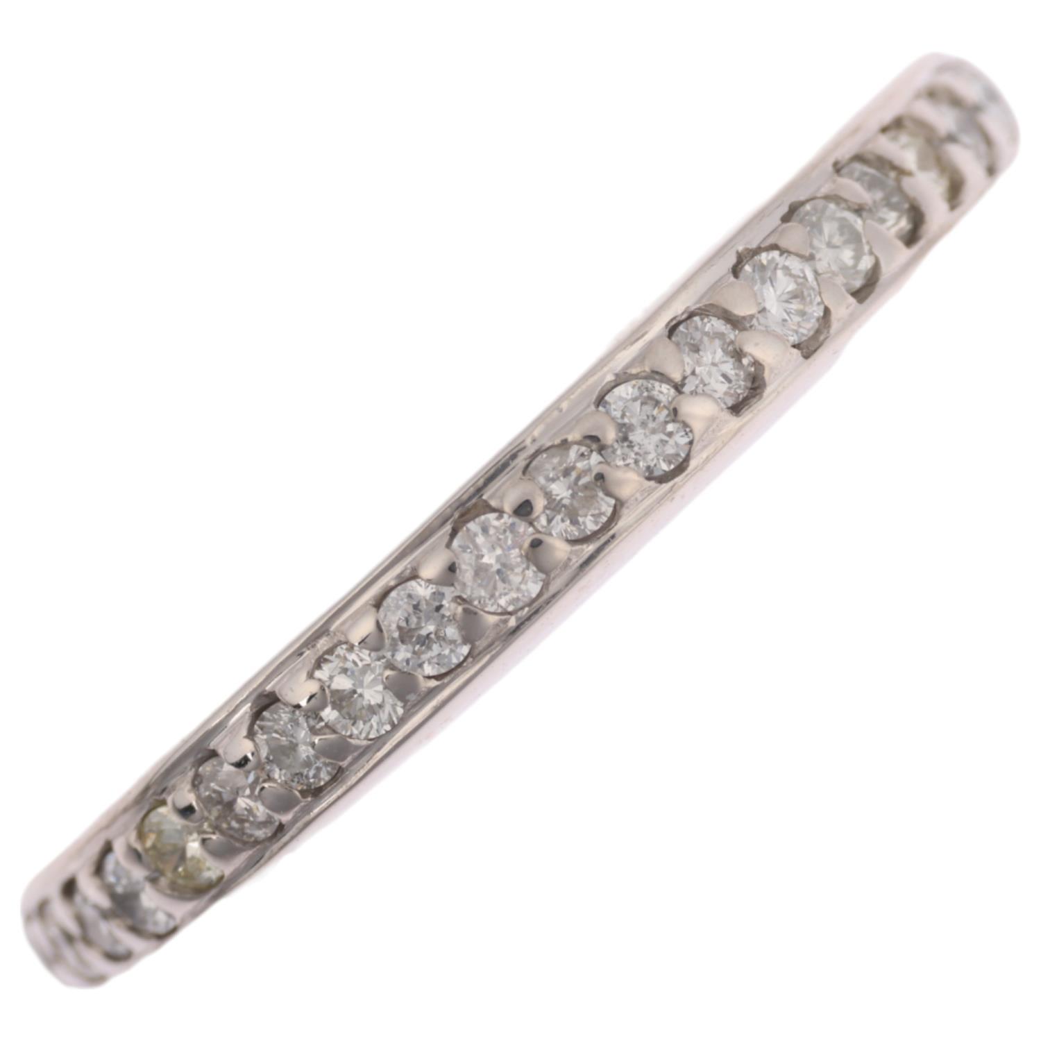 A diamond eternity ring, set with modern round brilliant-cut diamonds, total diamond content