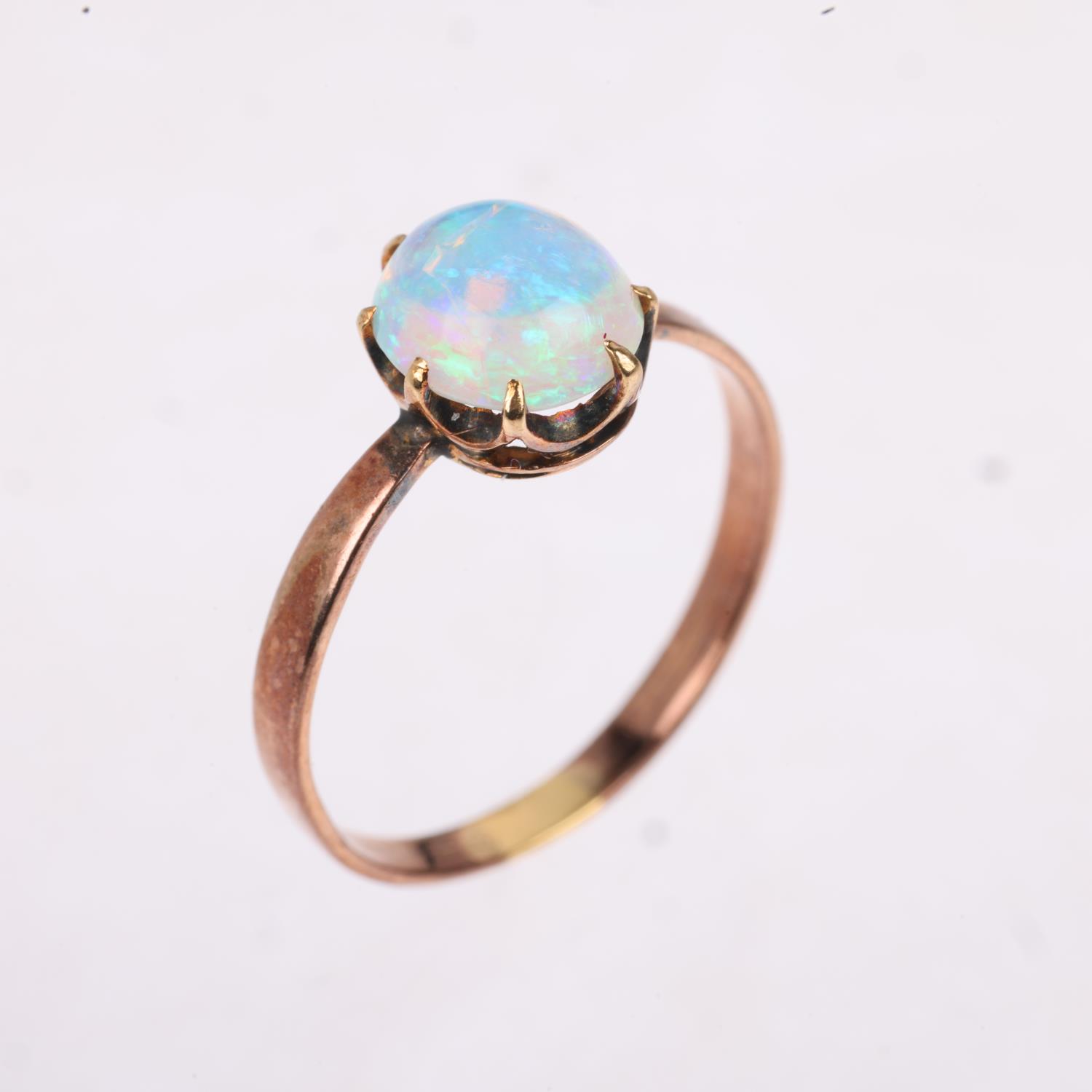 An early 20th century solitaire opal ring, claw set with 1ct oval cabochon opal, opal measures - Image 2 of 4
