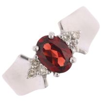 A modernist 14ct white gold garnet and diamond dress ring, maker KEL, setting height 7.2mm, size