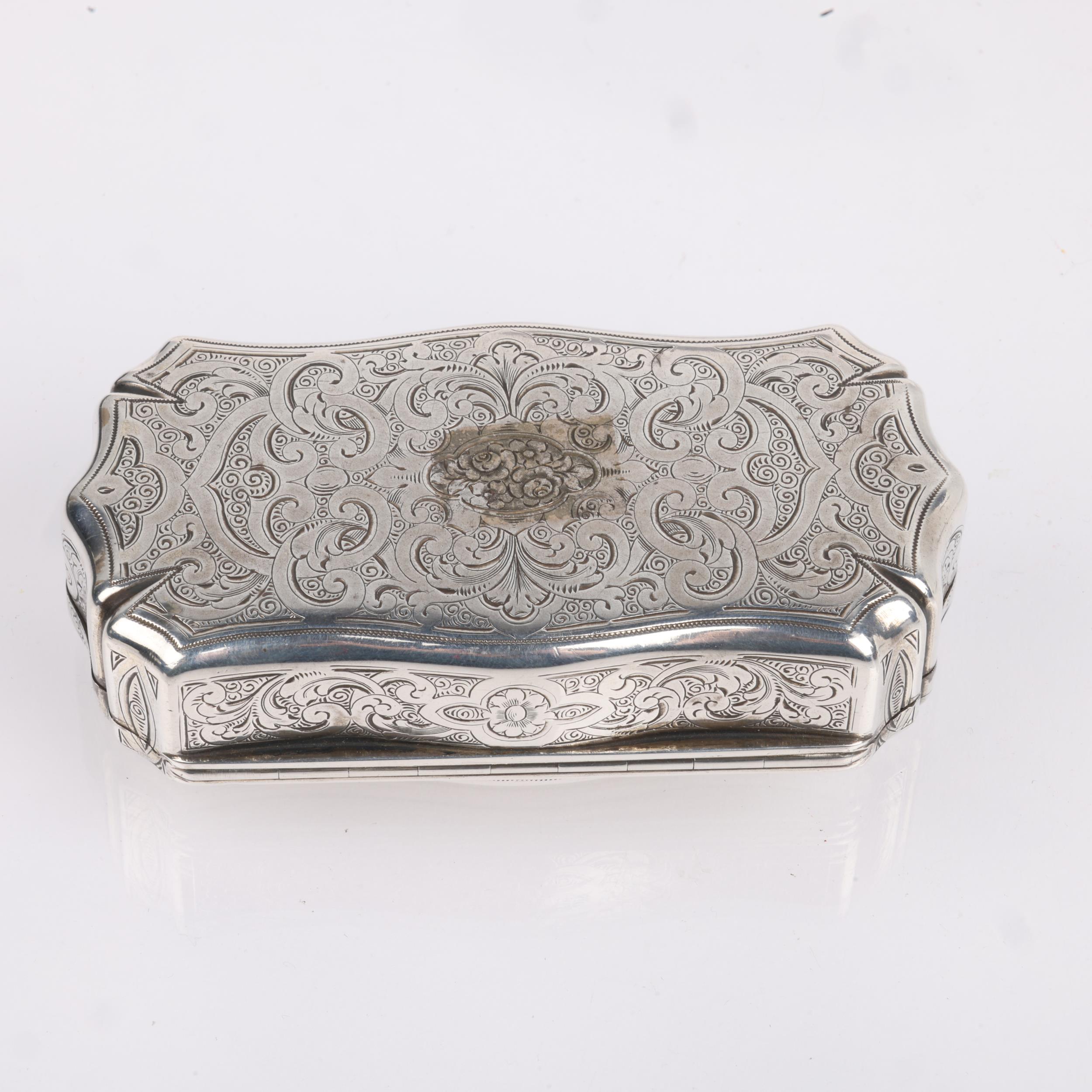 A 19th century French silver snuffbox, indistinct maker, shaped rectangular form, with allover - Image 2 of 3