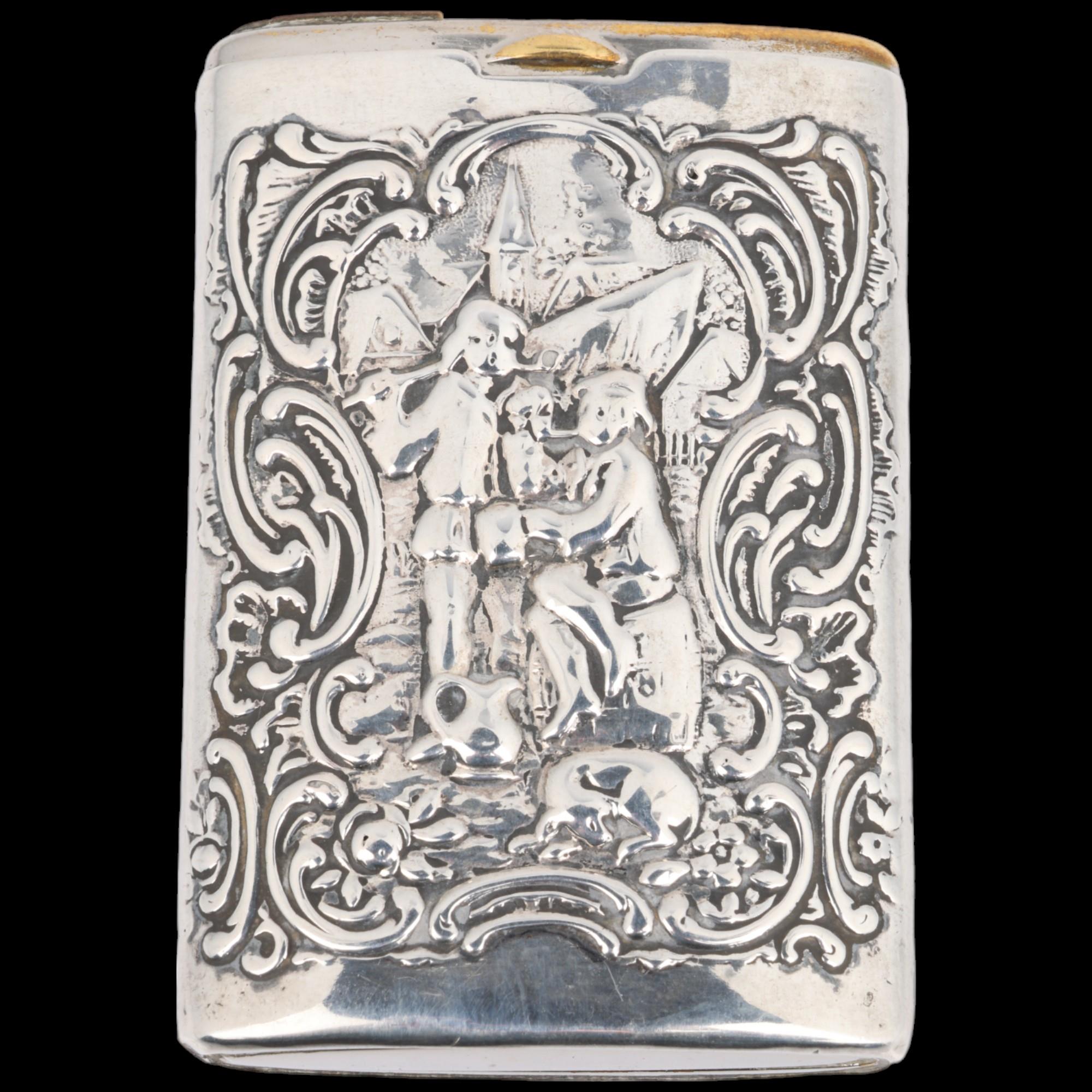 A Continental silver Vesta case, with relief embossed village decoration and sliding action, 6.5cm x