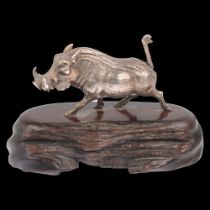 PATRICK MAVROS (Zimbabwean) - a cast-silver model warthog, realistically modelled on hardwood