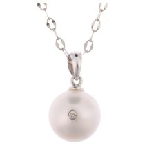 A modern 14ct white gold whole pearl and diamond pendant necklace, on 14ct cable link chain, set