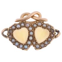 A Victorian chrysoberyl and pearl twin-heart pendant, circa 1890, each set with heart cabochon