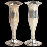 A pair of Edwardian silver bud vases, Walker & Hall, Chester 1906, weighted bases, 17.5cm Edge of
