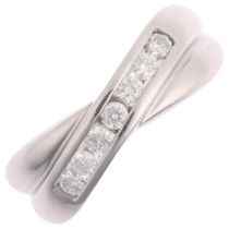 An 18ct white gold diamond crossover band ring, channel set with modern round brilliant-cut