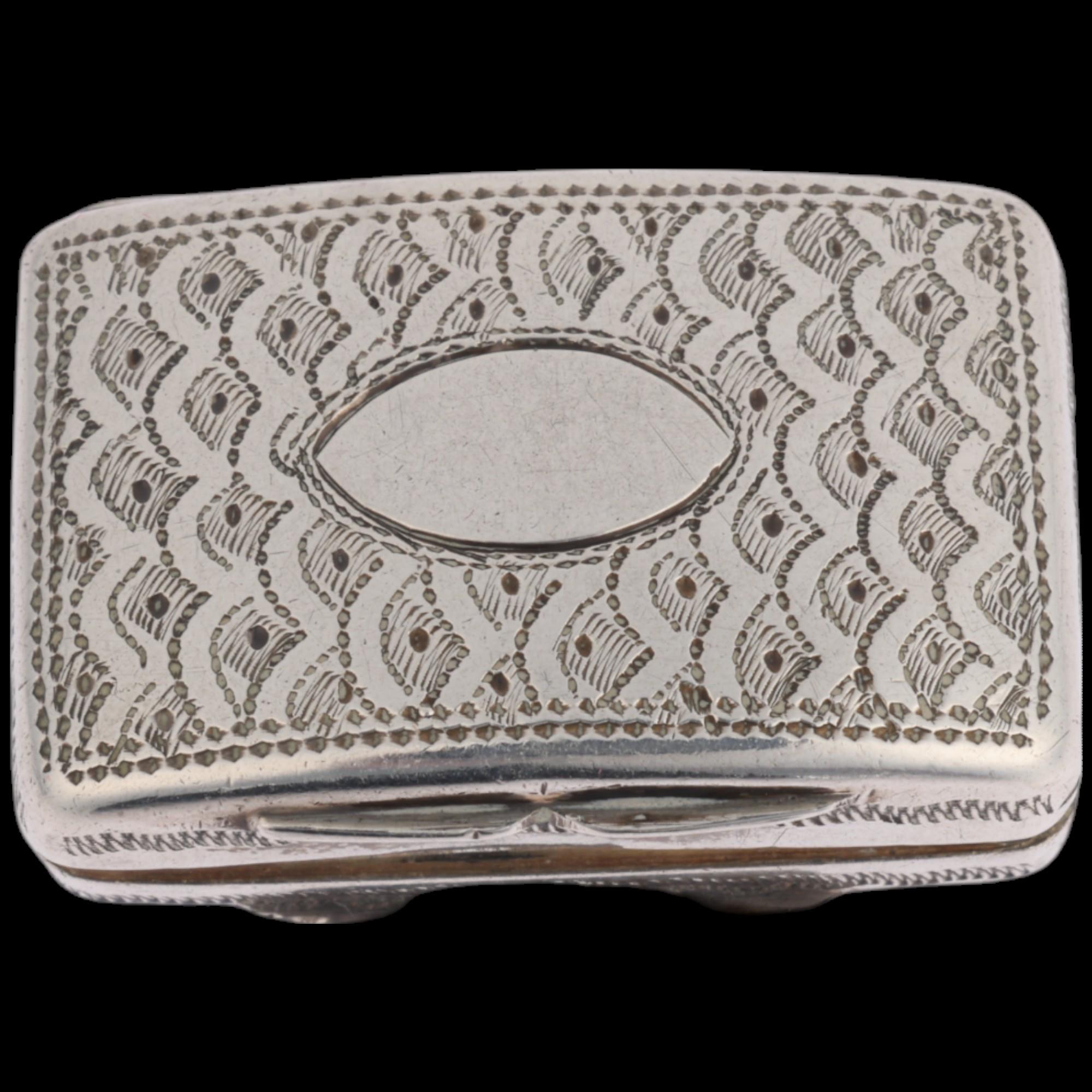 A George IV silver vinaigrette, maker TS, Birmingham 1822, curved rectangular form, with bright-