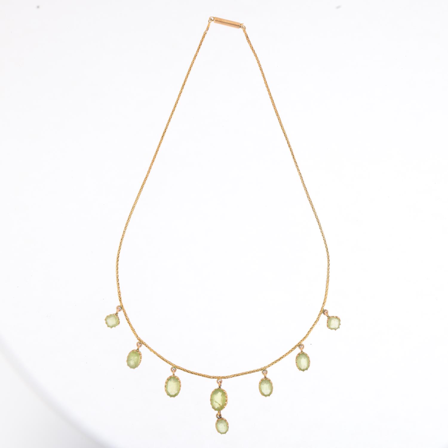An Edwardian peridot fringe necklace, circa 1910, claw set with oval mixed-cut peridot drops, on - Image 2 of 4