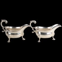 A fine pair of George II silver sauce boats, Robert Innes, London 1751, gadrooned rims with scrolled
