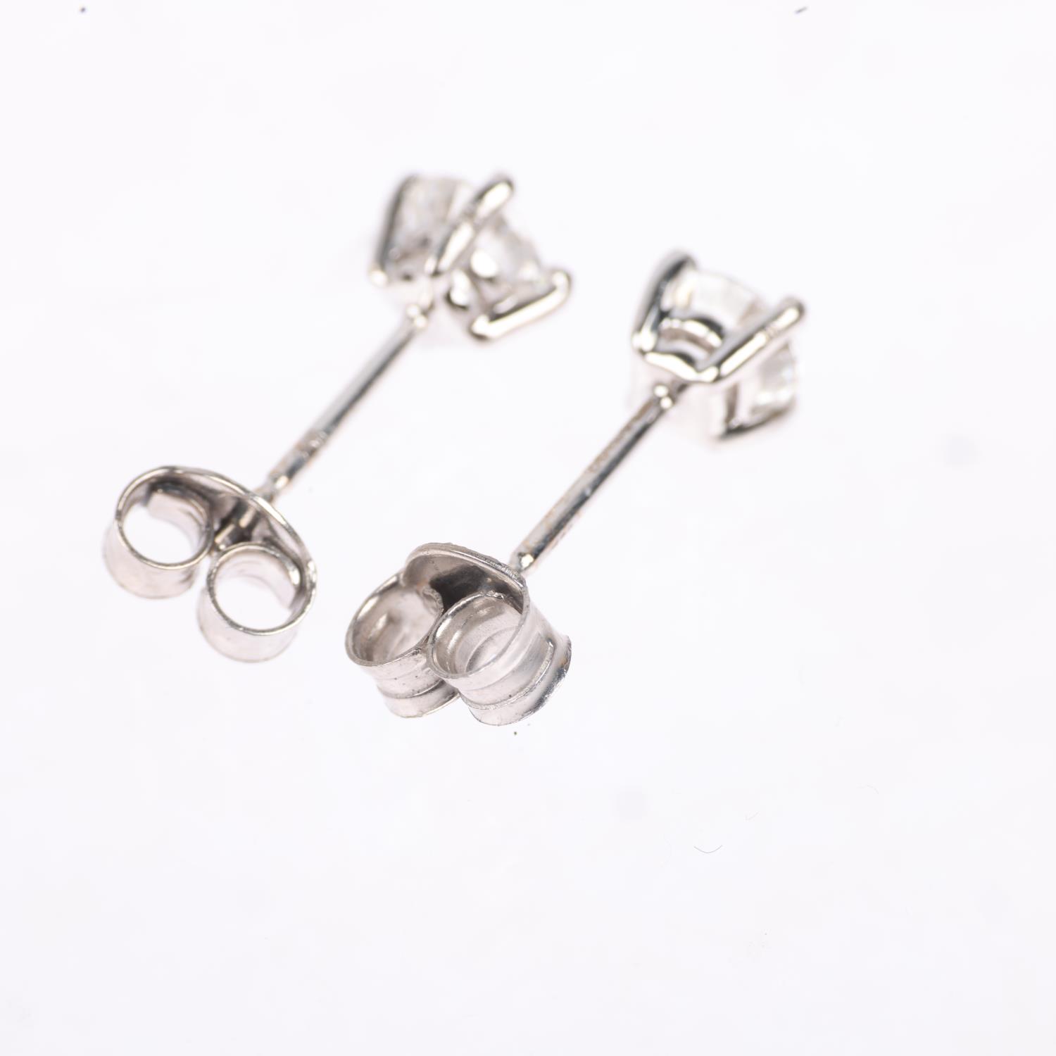 A pair of 18ct white gold 1.01ct solitaire diamond stud earrings, each claw set with individually - Image 3 of 4