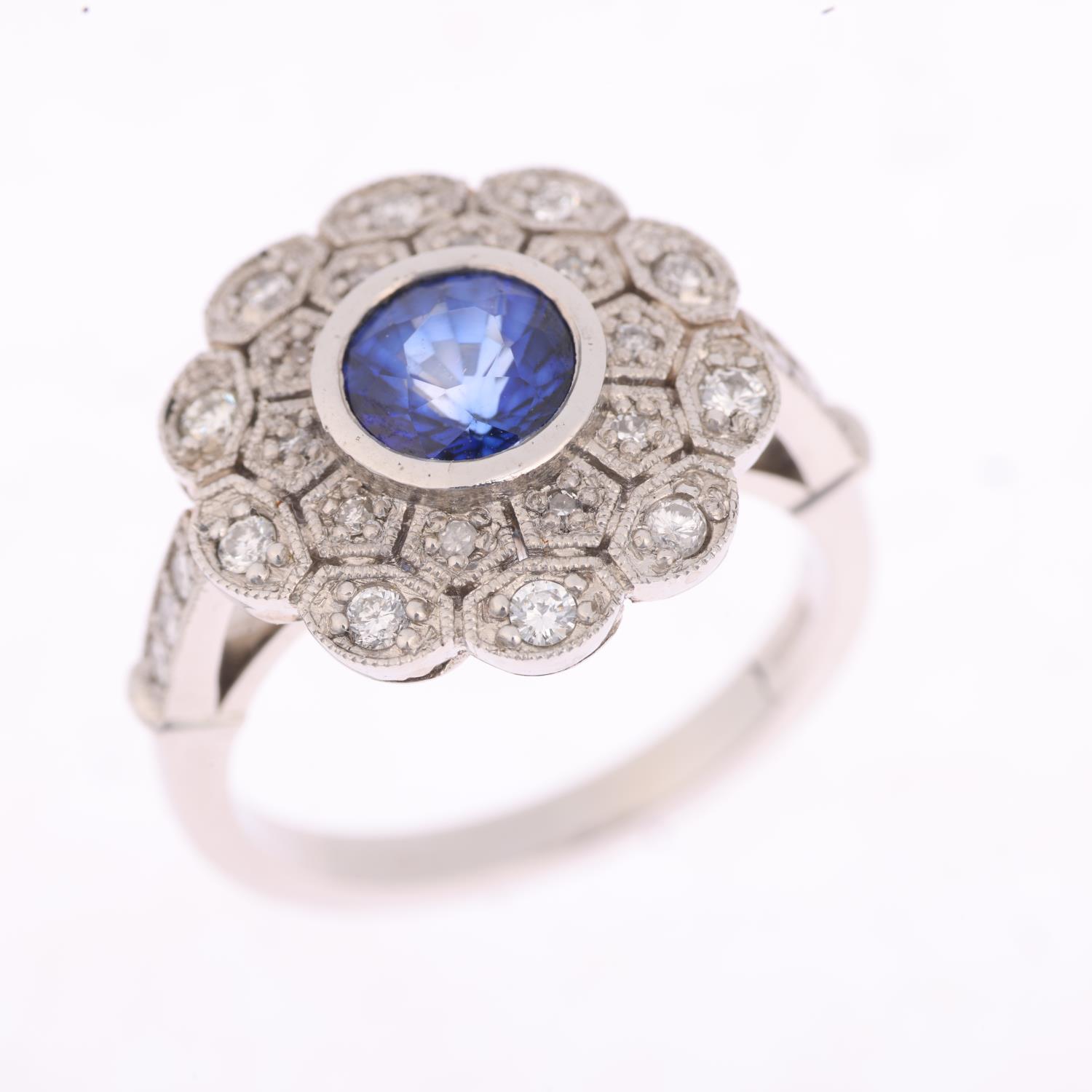 A platinum sapphire and diamond flowerhead cluster ring, maker JC, set with 1ct round-cut sapphire - Image 2 of 4