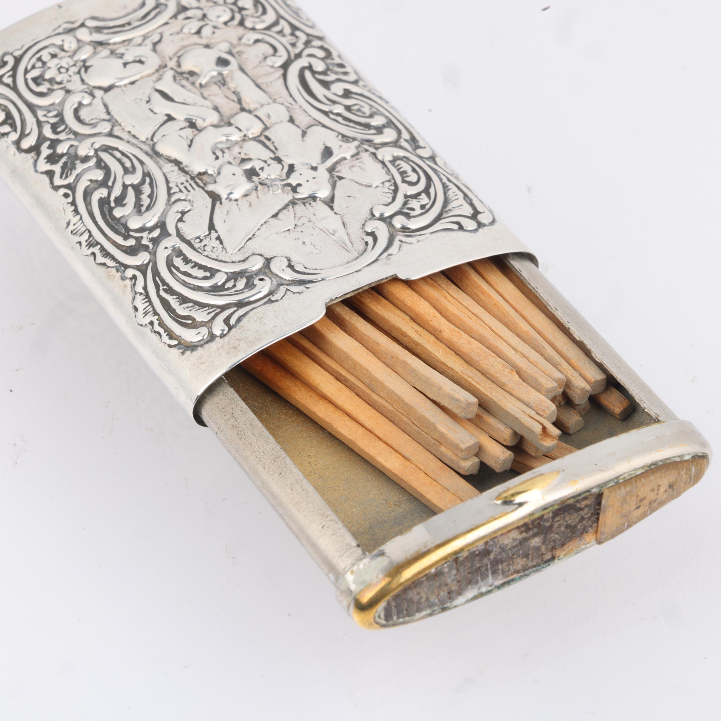 A Continental silver Vesta case, with relief embossed village decoration and sliding action, 6.5cm x - Image 3 of 3