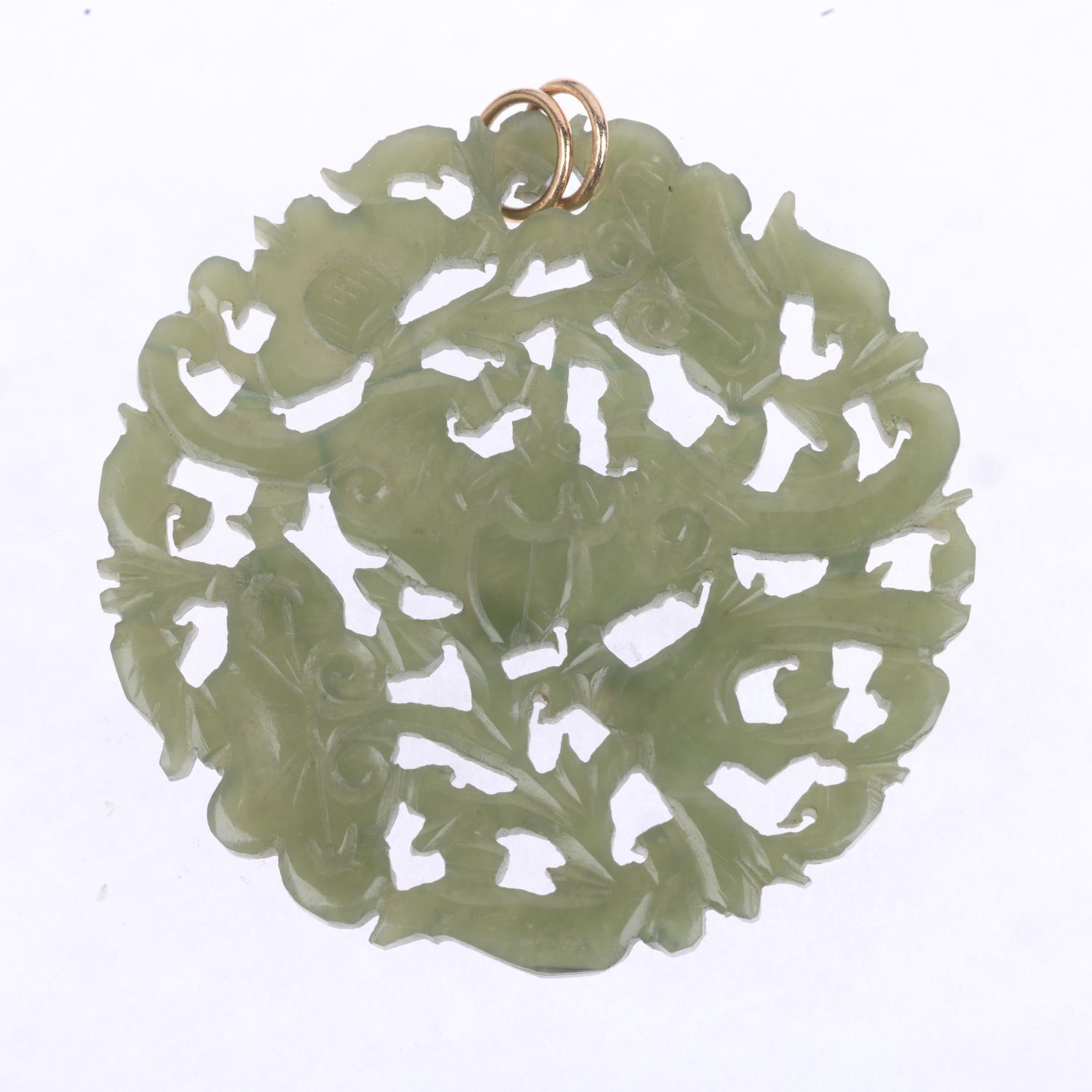 A Chinese jade 'Bat' disc pendant, carved and pierced decoration, 52.4mm, 13g No damage or repair - Image 2 of 4