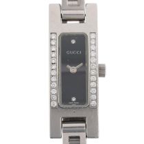 GUCCI - a lady's stainless steel diamond 3900L quartz bracelet watch, black dial with halfly diamond