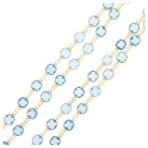 A 14ct gold blue topaz line necklace, set with double rose-cut topaz, 80cm, 16g No damage or repair,