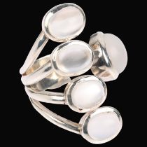 A sterling silver moonstone torque ring, setting height 35.6mm, size O, 12.8g No damage or repair,