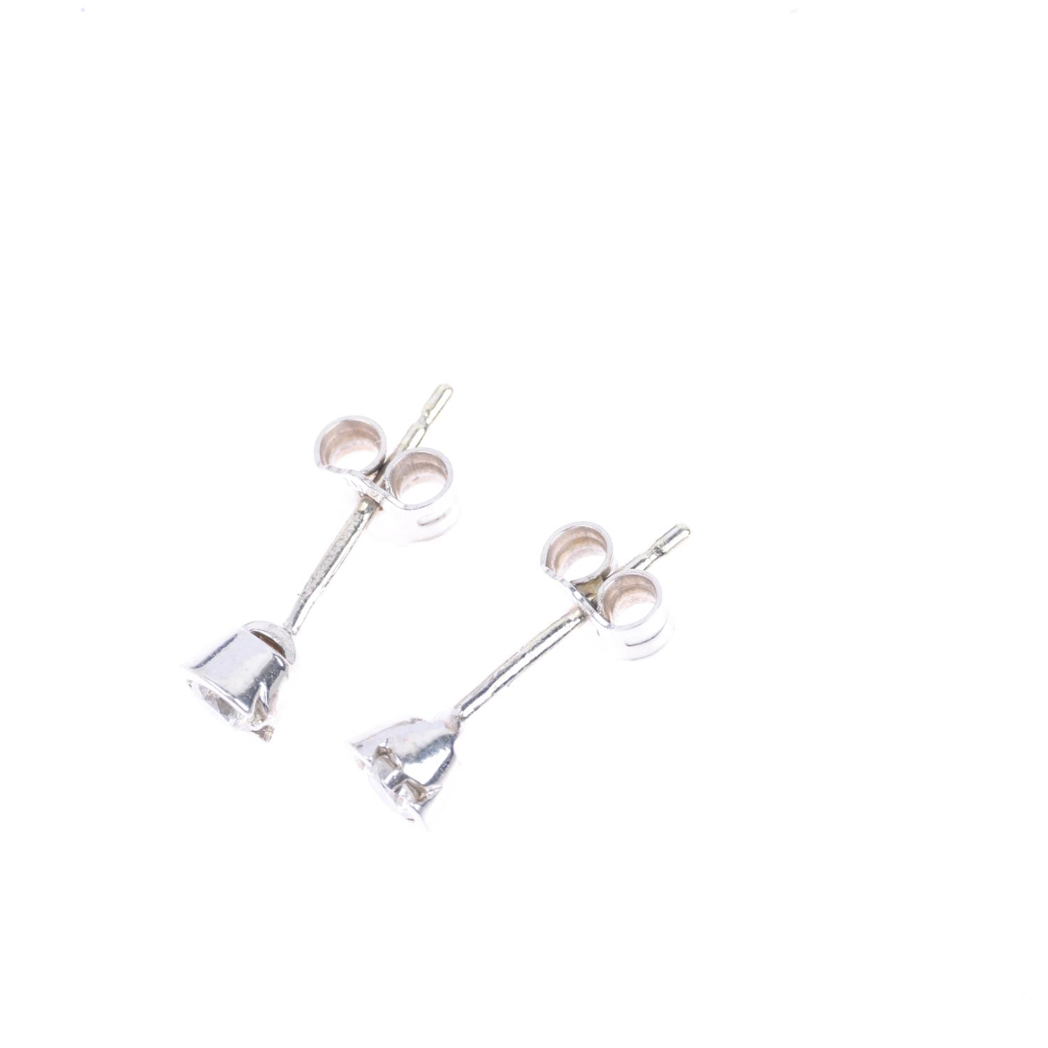 A pair of 9ct white gold 0.2ct solitaire diamond earrings, each set with 0.1ct modern round - Image 3 of 4