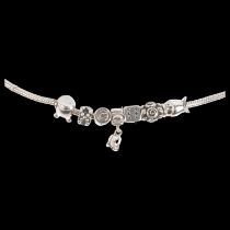 PANDORA - a sterling silver snake link charm bracelet, with 7 silver charms, 17.5cm, 34.3g 1 bent