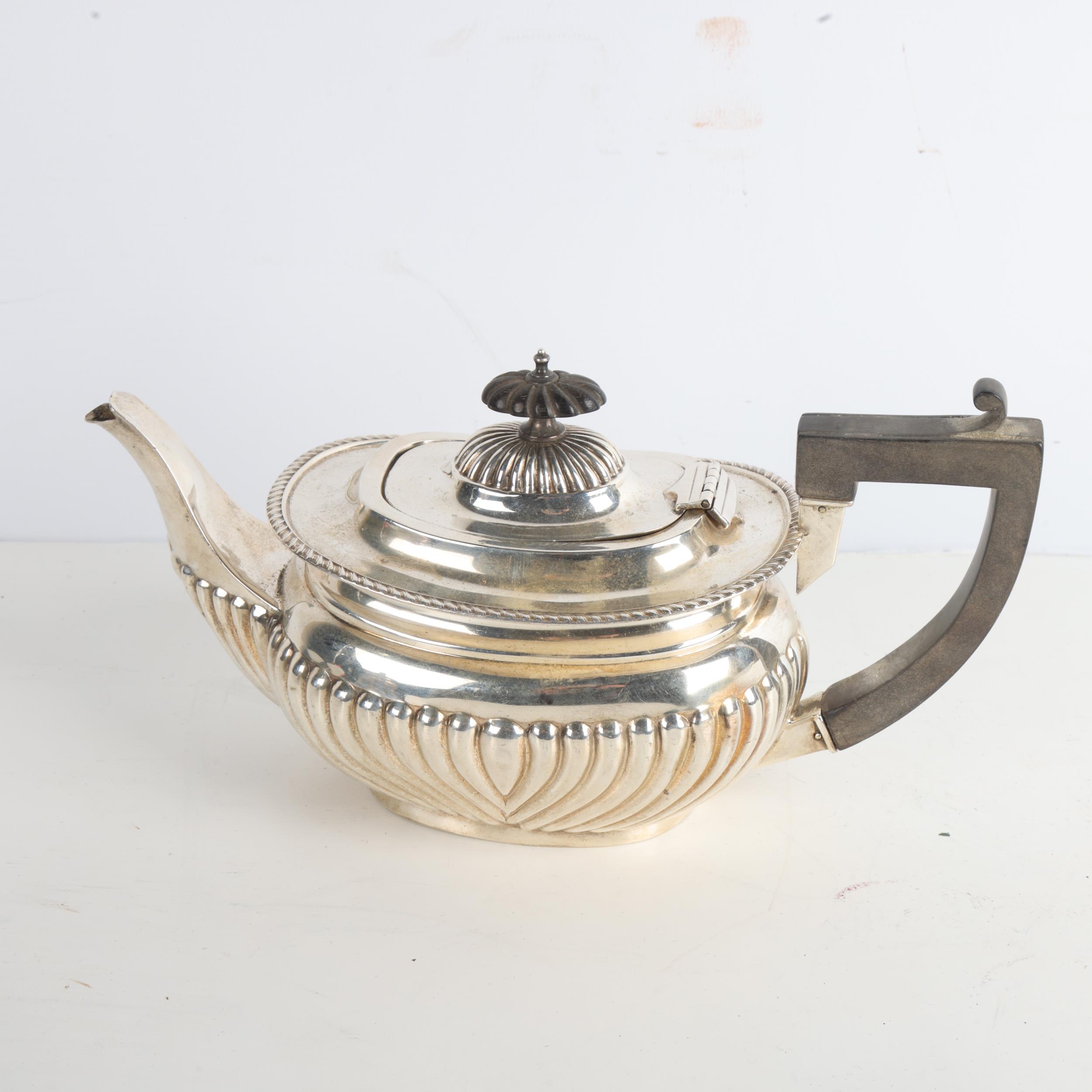 An Edwardian silver bachelor's teapot, William Aitken, Birmingham 1902, oval bulbous form with - Image 2 of 3