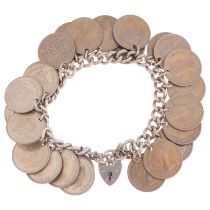 A silver curb link sixpence charm bracelet, 17cm, 92.1g No damage or repair, clasp working