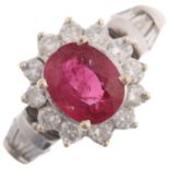 An 18ct white gold ruby and diamond flowerhead cluster ring, claw set with 1.1ct oval mixed-cut