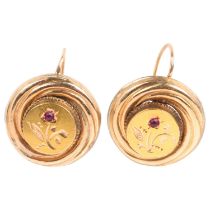 A pair of Victorian garnet earrings, unmarked gold settings with engraved floral decoration and