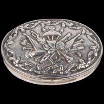 An 18th century Continental silver snuffbox, oval form with relief embossed weapon armaments