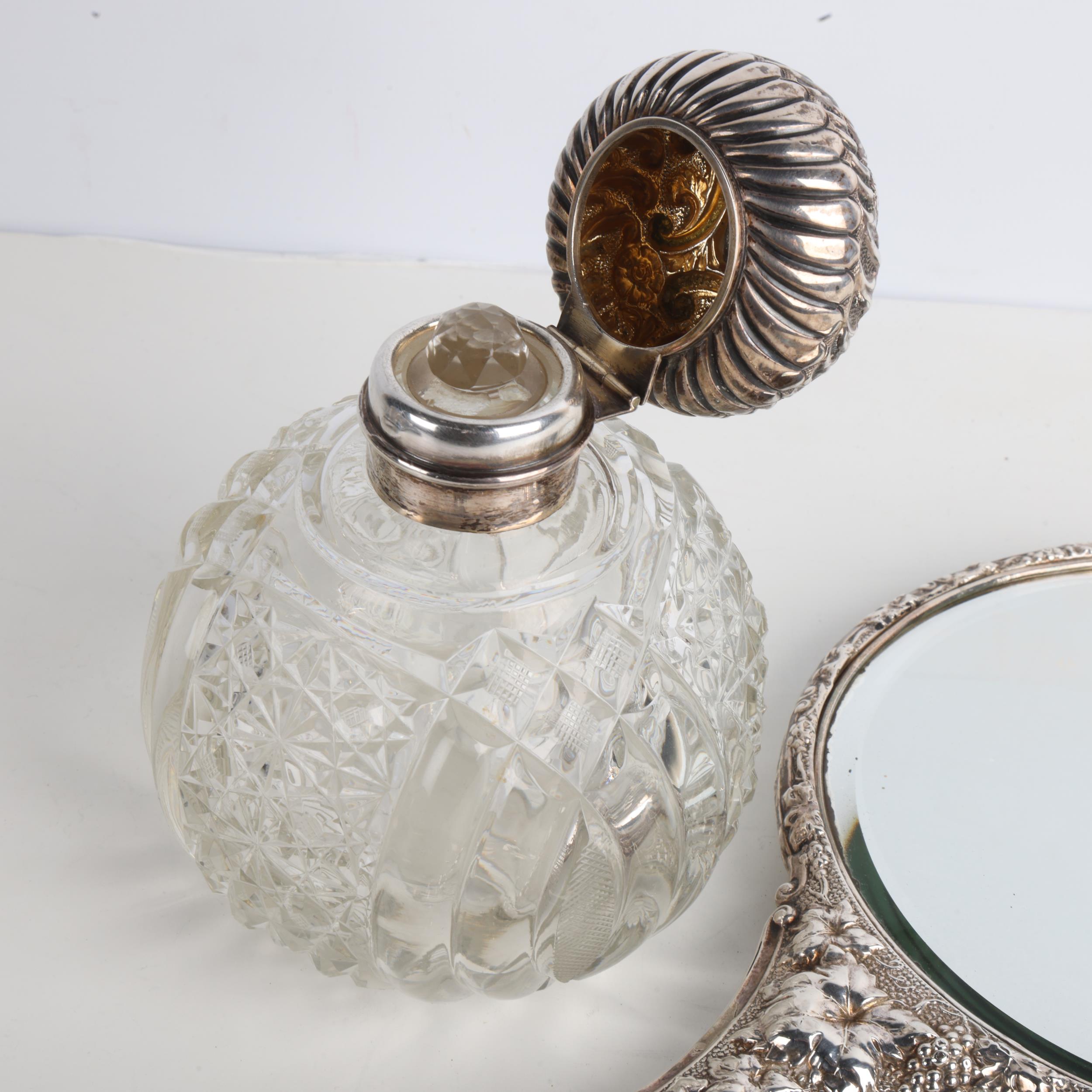 An Edwardian silver dressing table hand mirror, Birmingham 1903, and a silver-mounted glass scent - Image 3 of 3