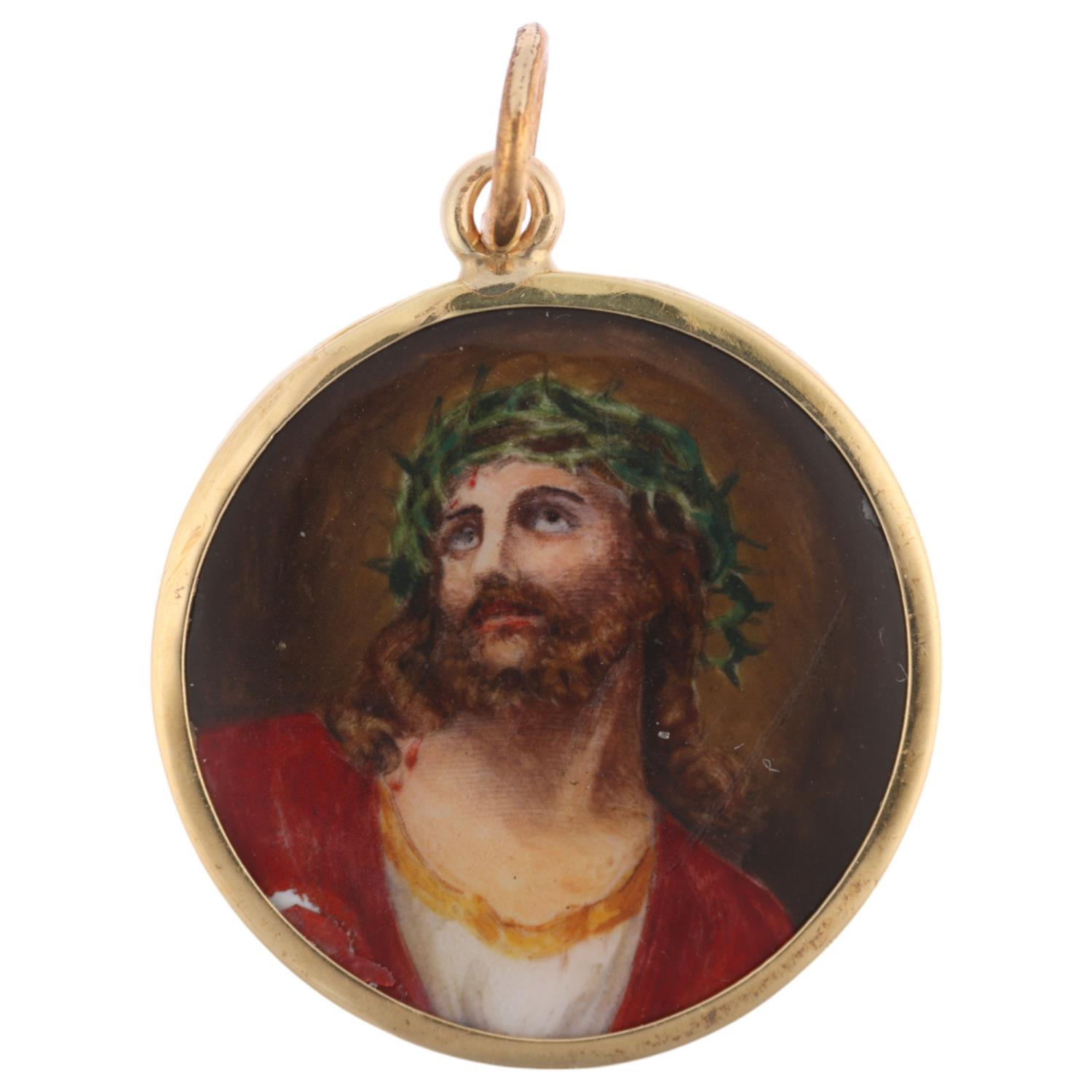 A Vintage enamel 'Jesus Christ' pendant, hand painted decoration with engine turned sunburst