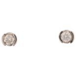 A pair of 9ct white gold 0.2ct solitaire diamond earrings, each set with 0.1ct modern round