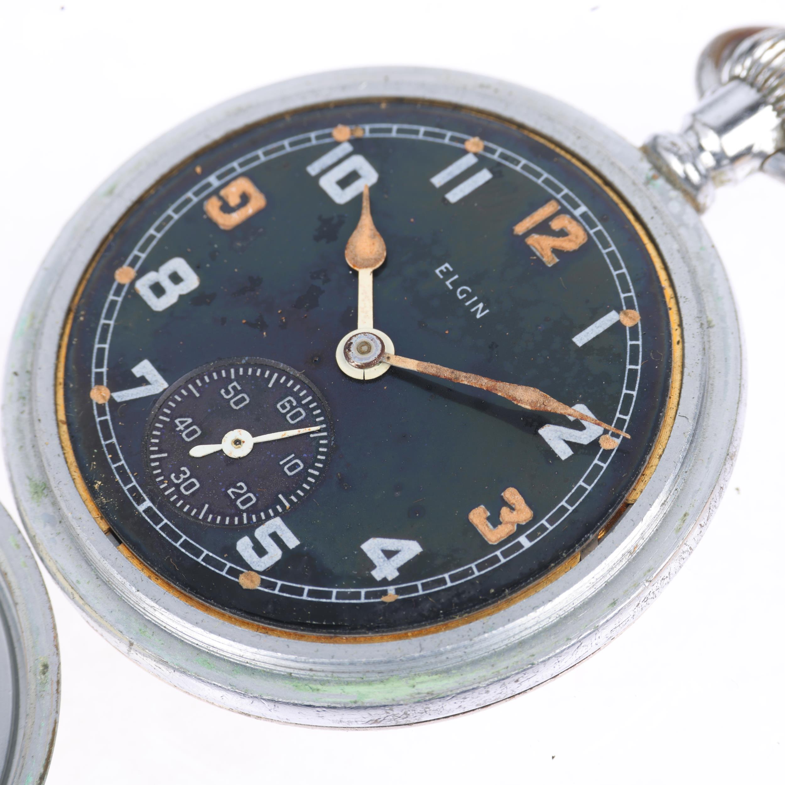ELGIN - a Second World War Period nickel plated open-face keyless pocket watch, black dial with - Image 5 of 5
