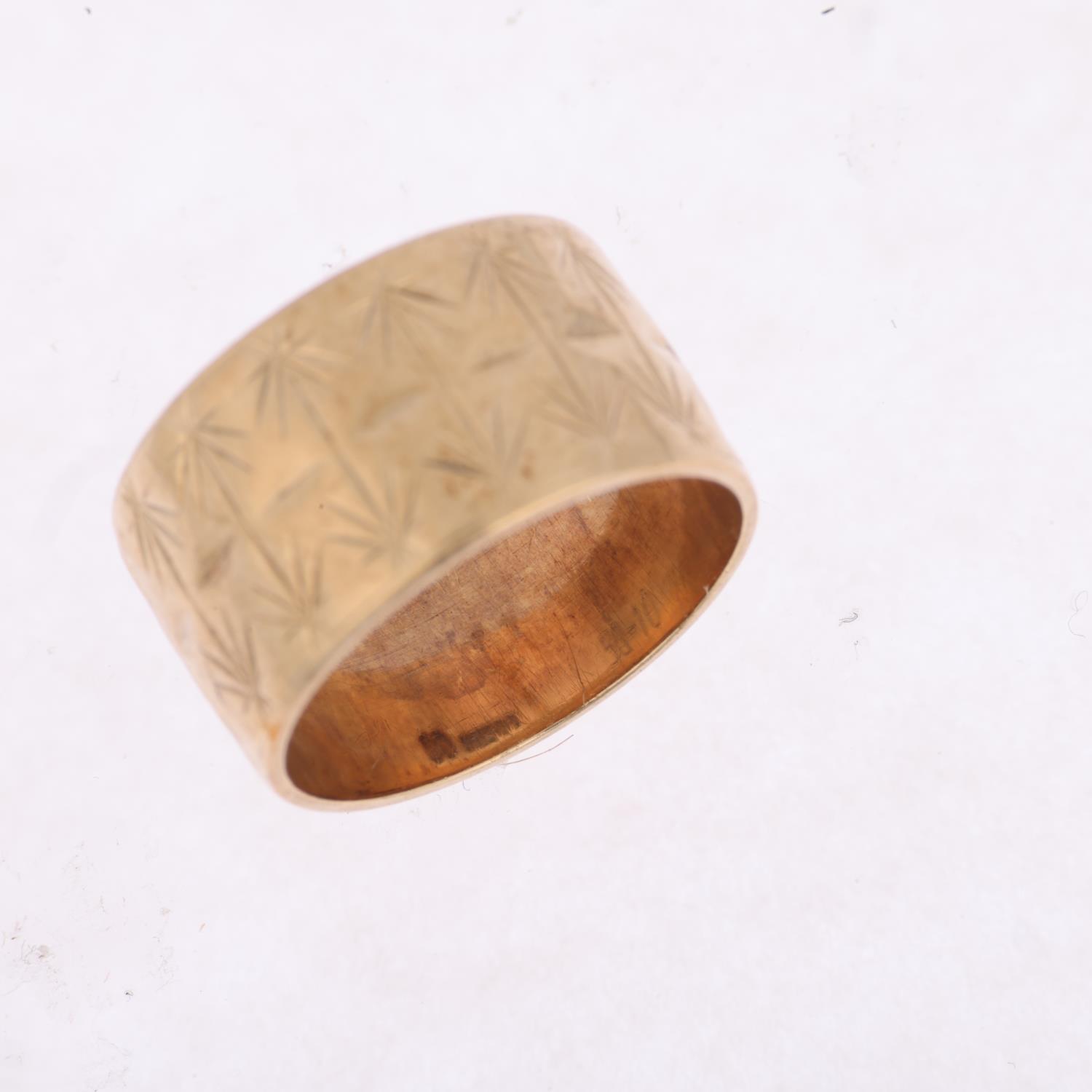 A late 20th century 9ct gold wedding band ring, maker BW, London 1973, engraved leaf decoration, - Image 2 of 4