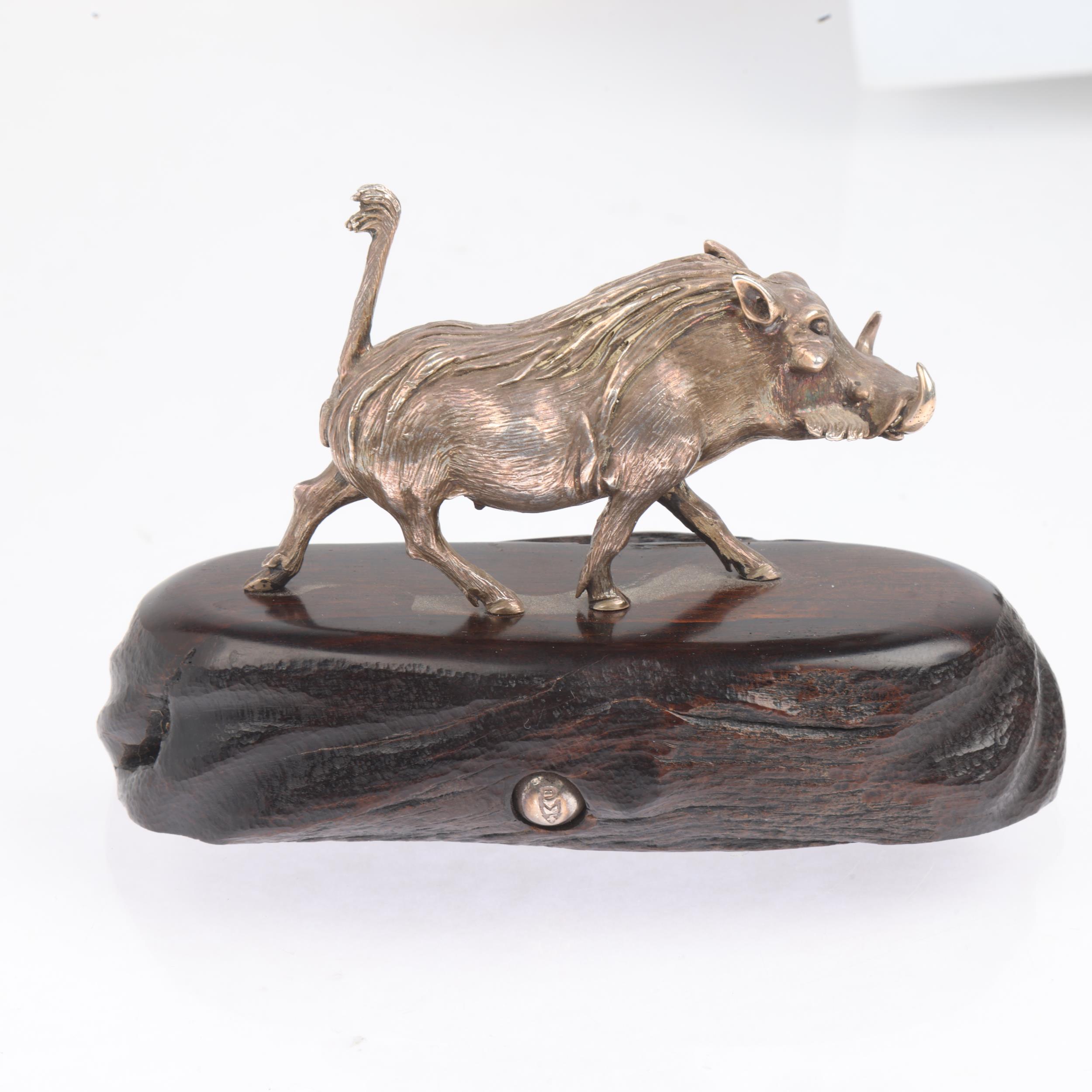 PATRICK MAVROS (Zimbabwean) - a cast-silver model warthog, realistically modelled on hardwood - Image 2 of 3