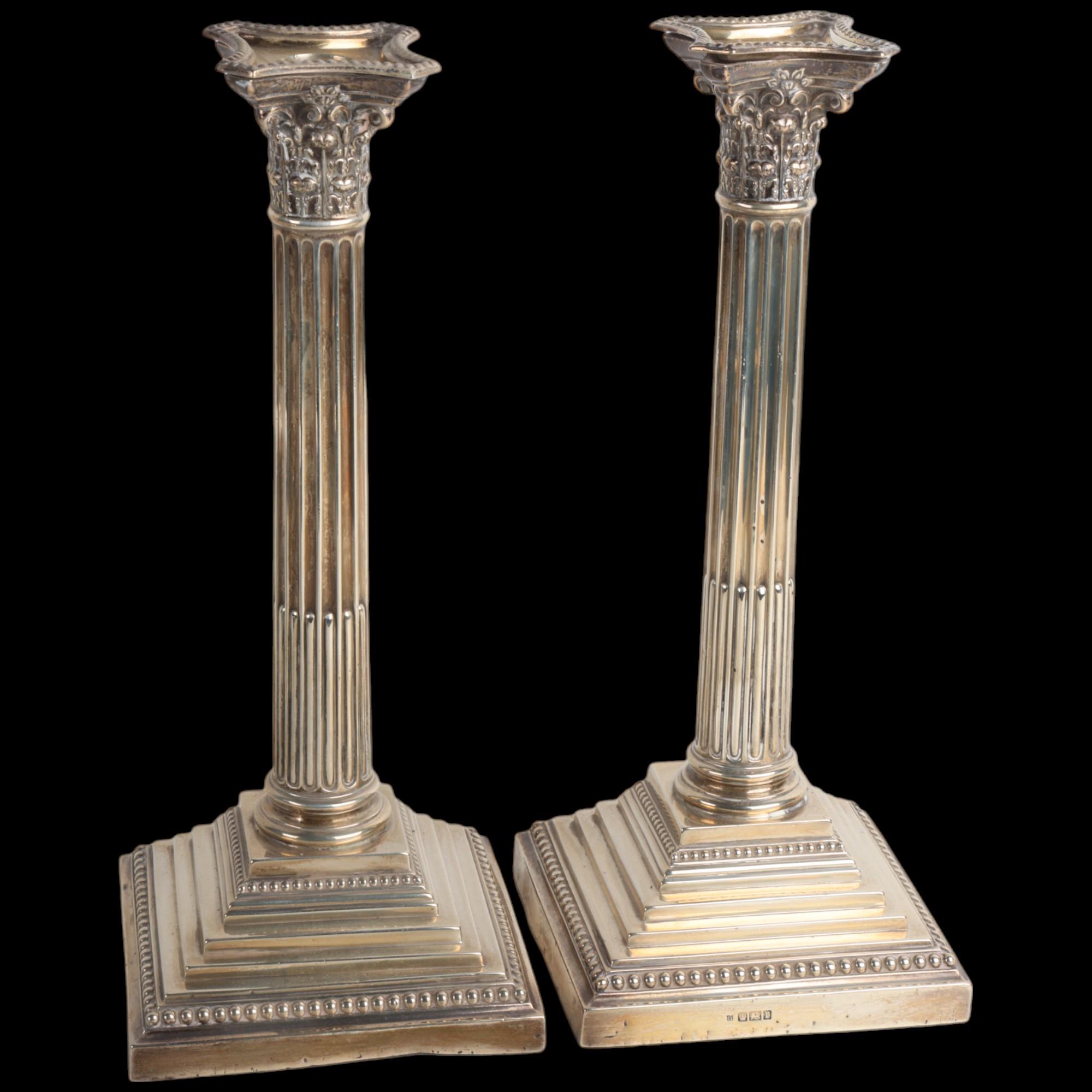 A pair of Edwardian silver Corinthian column table candlesticks, Walter Latham & Son, Sheffield
