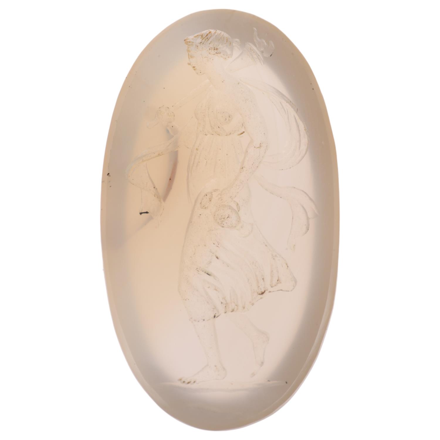 An Antique agate intaglio seal ringstone, carved depicting Classical lady holding flaming torch