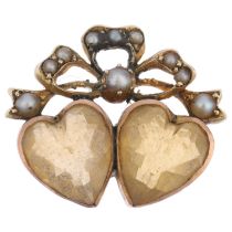 An Antique citrine and split pearl twin-heart pendant, circa 1900, each set with heart-cut citrine