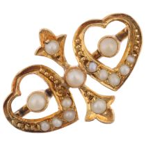 A Victorian split pearl twin-heart ring, apparently unmarked, setting height 13.6mm, size N, 1.8g