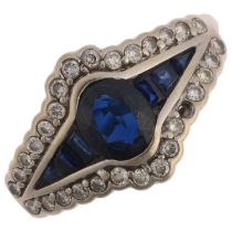 A 9ct white gold sapphire and diamond eye cluster ring, in the Art Deco style, setting height 11.