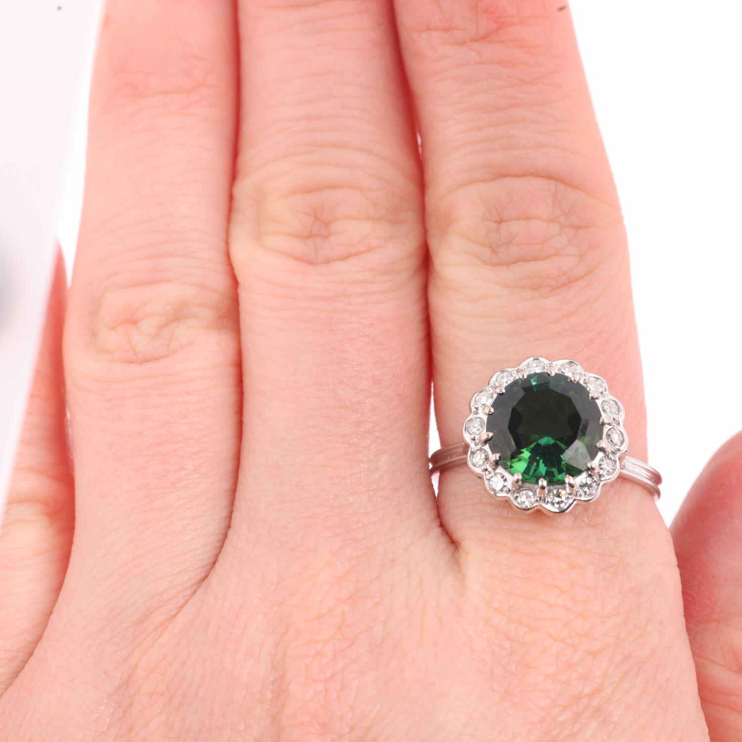 An 18ct white gold green tourmaline and diamond flowerhead cluster ring, centrally claw set with 3ct - Image 4 of 4