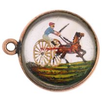 An early 20th century Essex Crystal style horse cart racing pendant, in gilt-metal frame, 16.8mm,