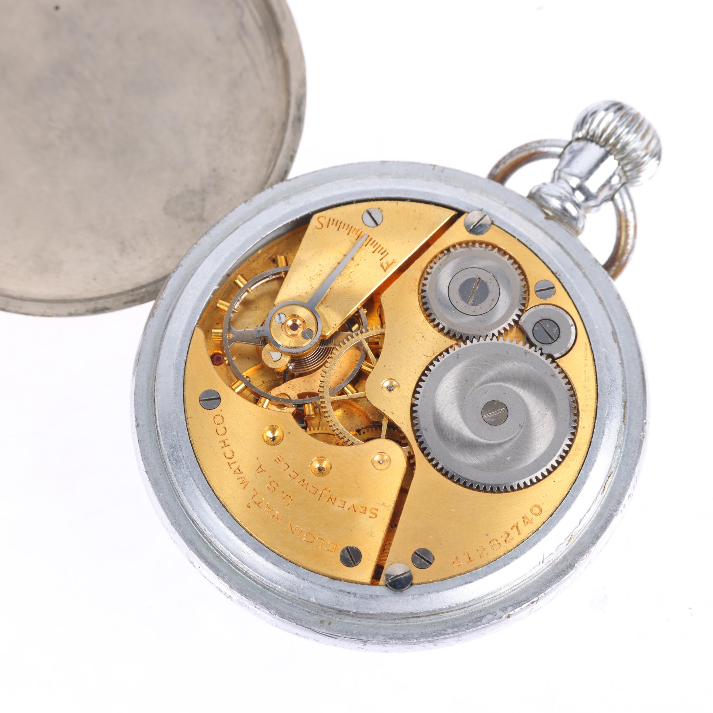 ELGIN - a Second World War Period nickel plated open-face keyless pocket watch, black dial with - Image 3 of 5