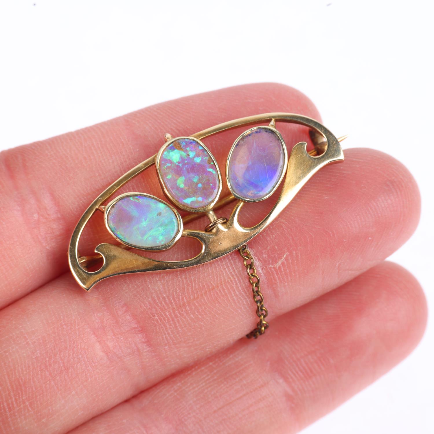 MURRLE BENNETT - an Art Nouveau 15ct gold opal openwork brooch, circa 1905, rub-over set with oval - Image 4 of 4