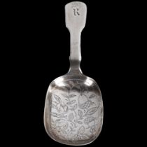A George IV silver Fiddle pattern tea caddy spoon, William Traies, London 1826, bright-cut floral
