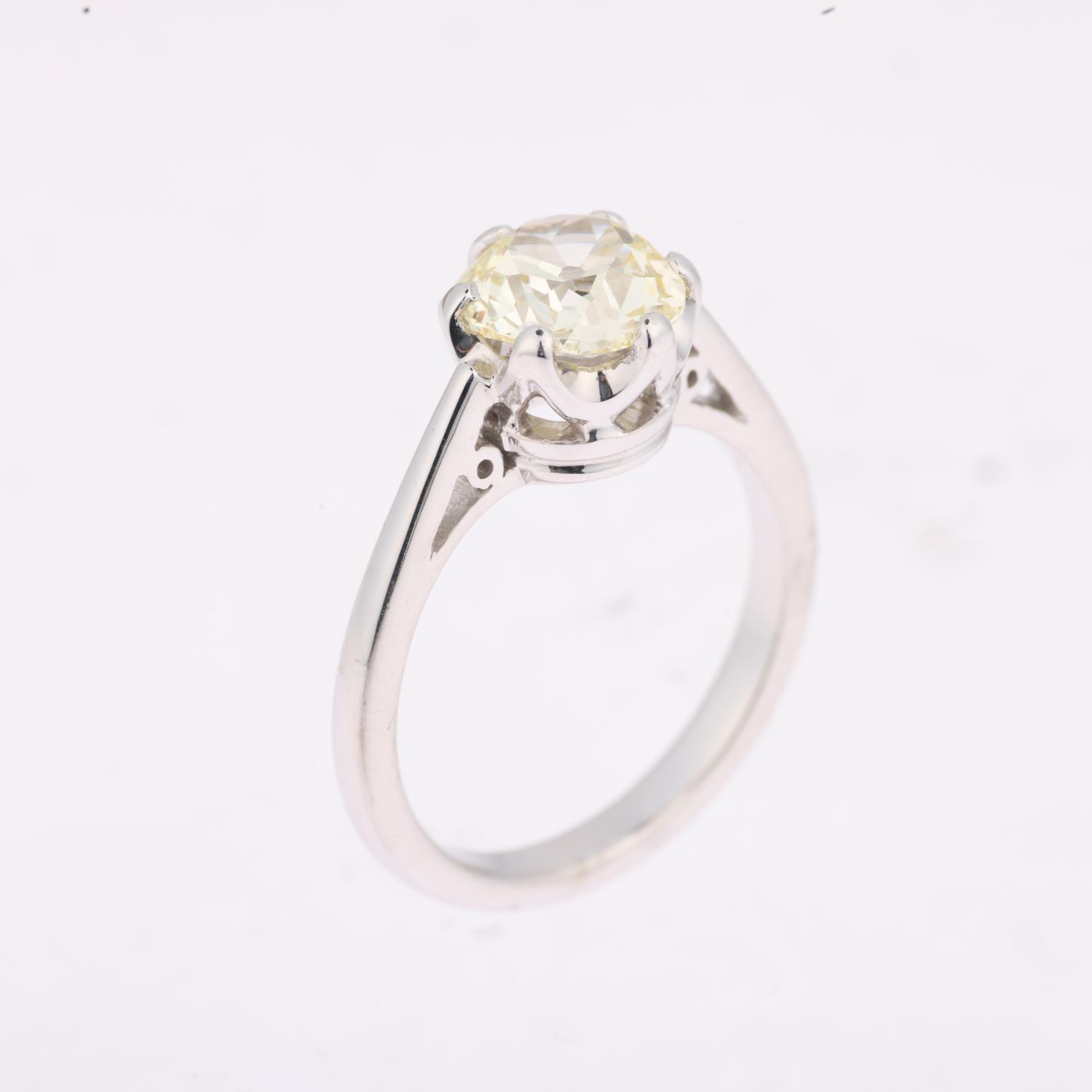 An 18ct white gold 1.9ct solitaire diamond ring, claw set with 1.9ct light yellow old-cut diamond, - Image 2 of 4