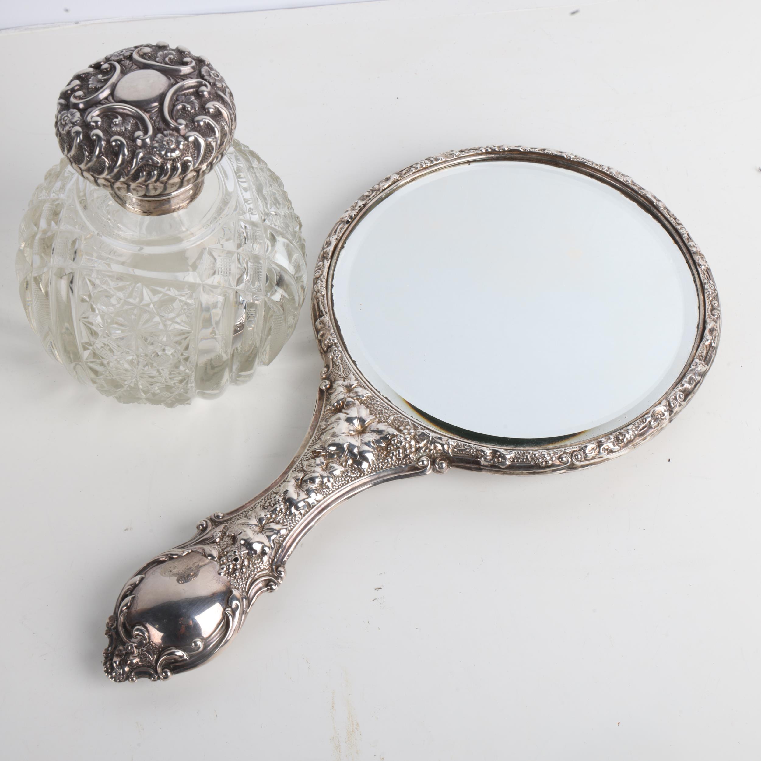 An Edwardian silver dressing table hand mirror, Birmingham 1903, and a silver-mounted glass scent - Image 2 of 3