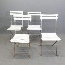 A set of four Parisienne folding bistro café chairs.