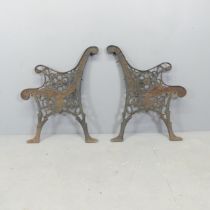 A pair of painted cast-iron bench ends. Height 72cm.