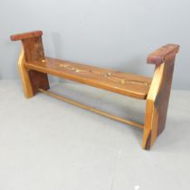 A stained pine bench with abstract river bed decoration to seat, by local artist Clive